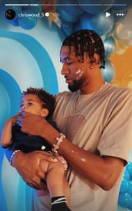 Wood poses with his son on his first birthday (Image: Christian's Instagram)